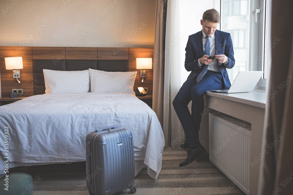 Young businessman in room