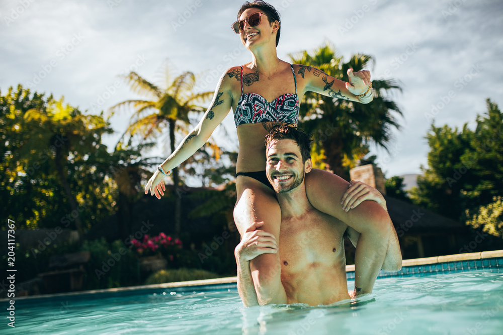 Couple having fun in swimming pool