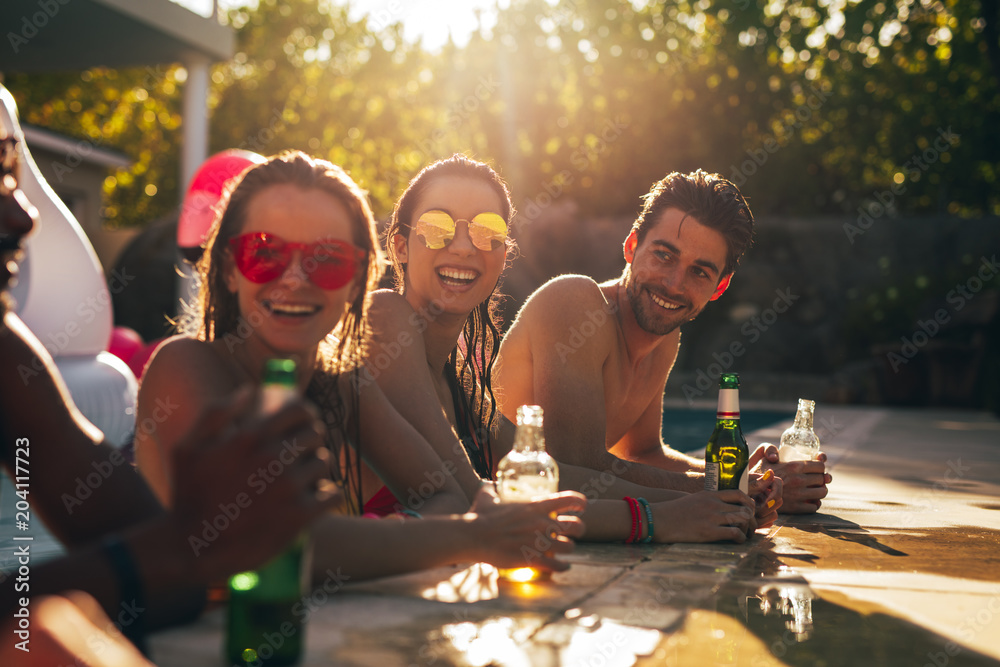 Friends enjoying at pool party