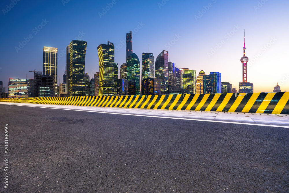 empty aspalt road with modern office building