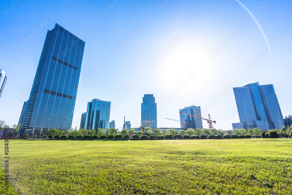 green lawn with modern office building