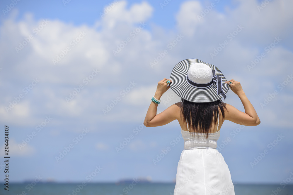 Woman in summer vacation wearing hat