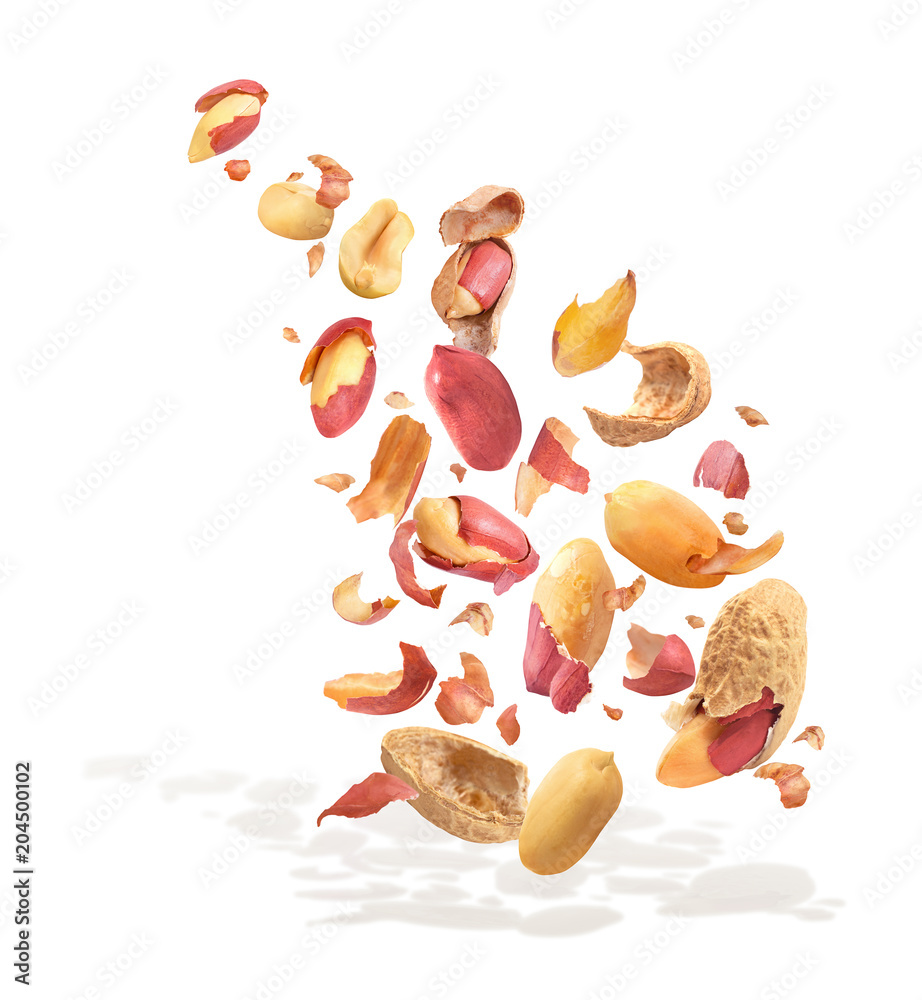 Peanuts crushed in the air close-up on a white background