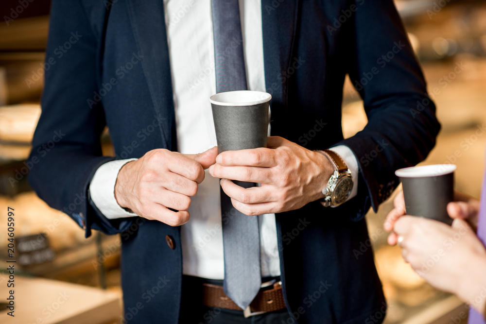 Business people with coffee cups