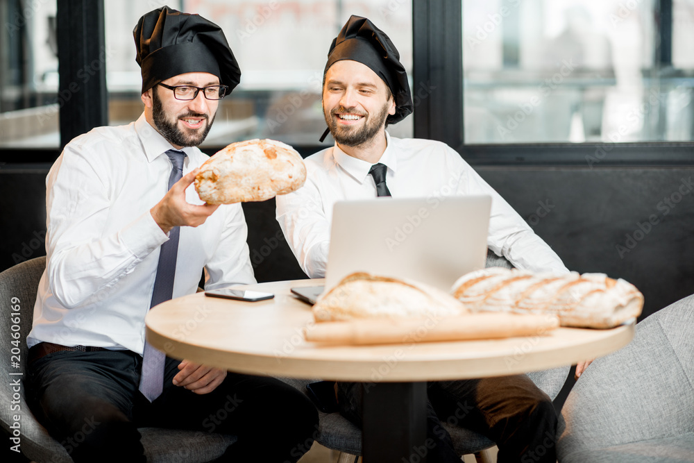 Bakers working with bread in the office