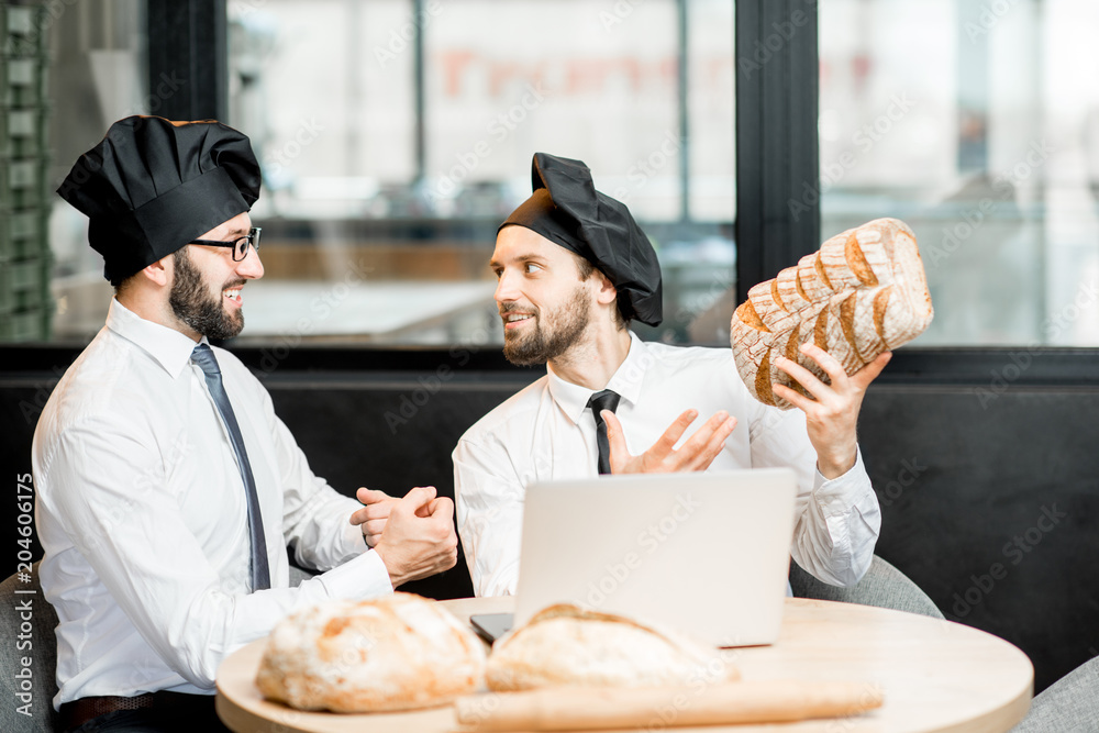 Bakers working with bread in the office