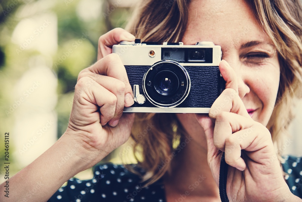 Woman taking picture with camera