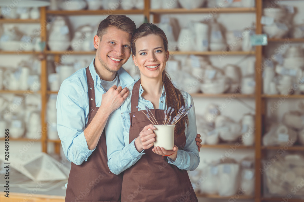 Young couple with a ceramic vase