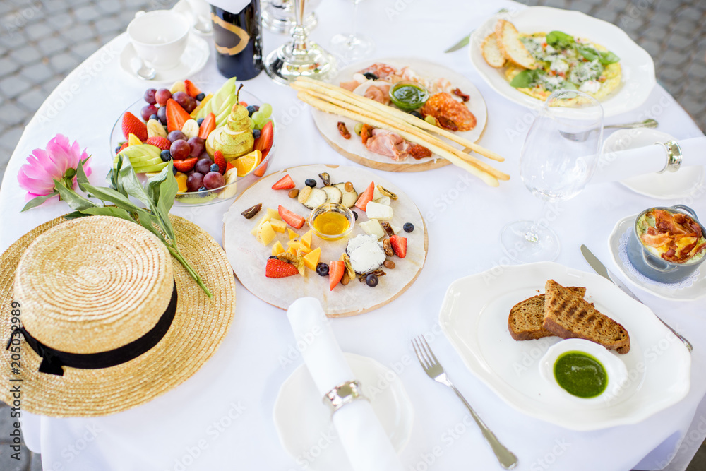 Table with romantic breakfast outdoors