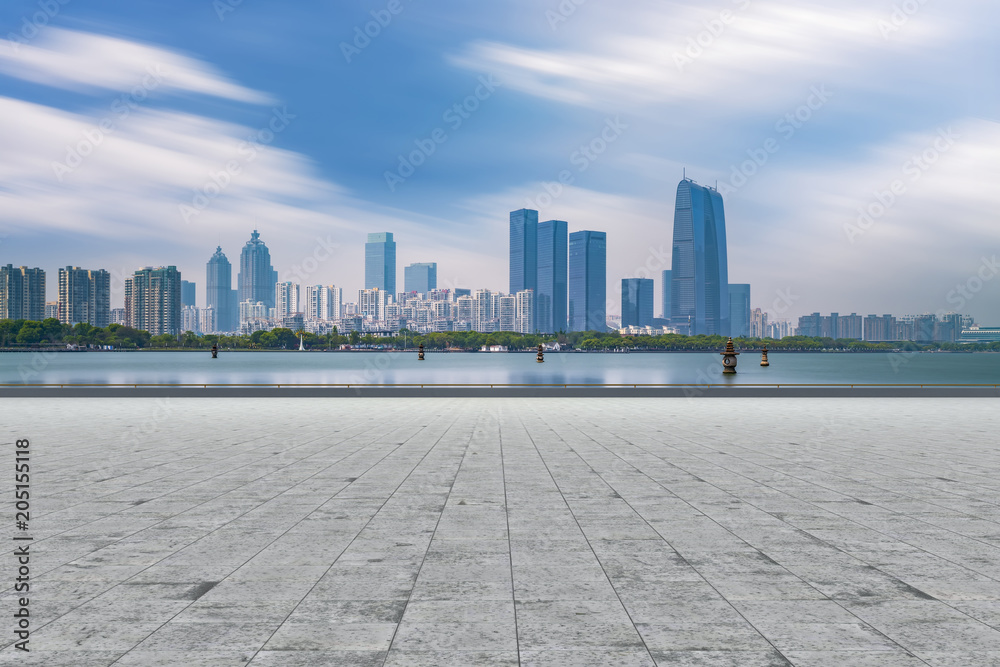 City square floor tiles and skyscrapers