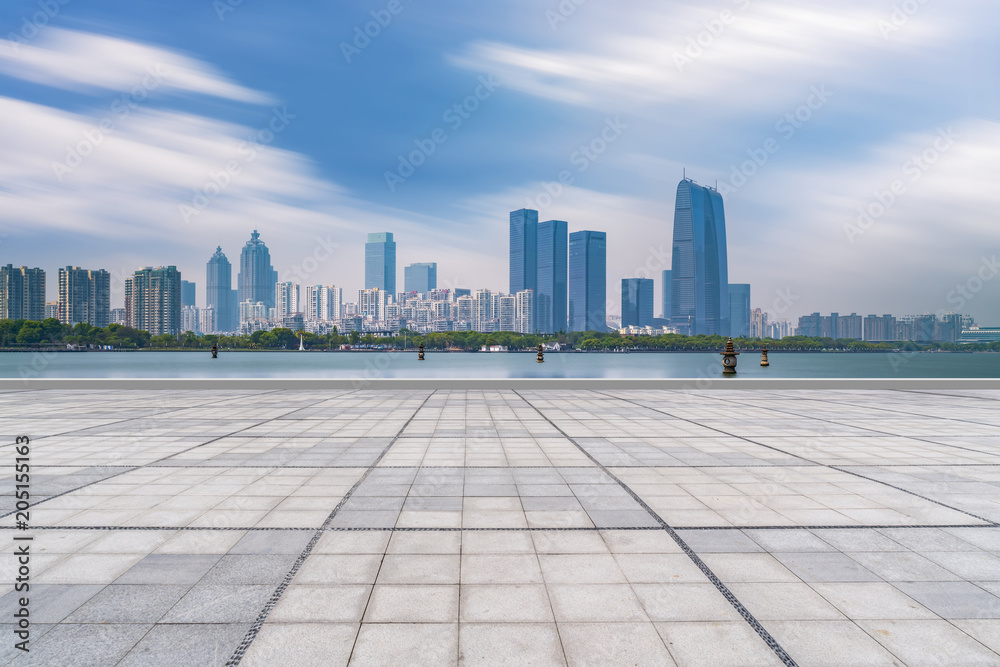 City square floor tiles and skyscrapers