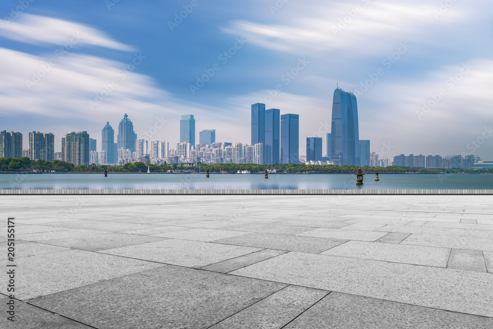 City square floor tiles and skyscrapers