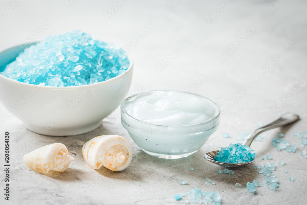 blue spa composition with shells and natural soap on stone desk 