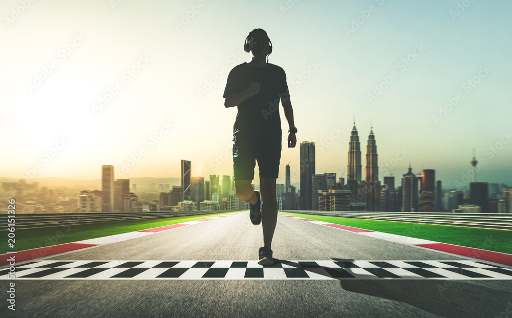 Athlete running on start and finish line street with city skyline background . sport motivation conc