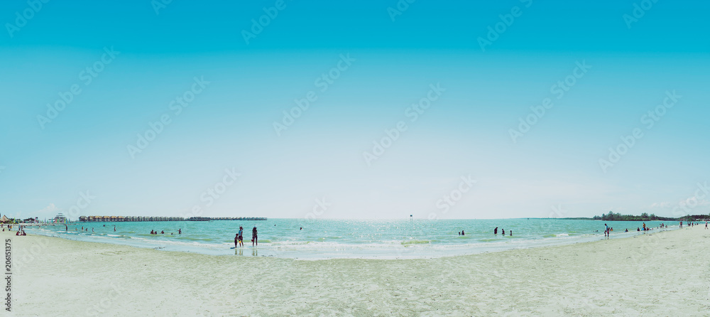 People relaxing on the Sepang beach , most famous beach in the Malaysia.