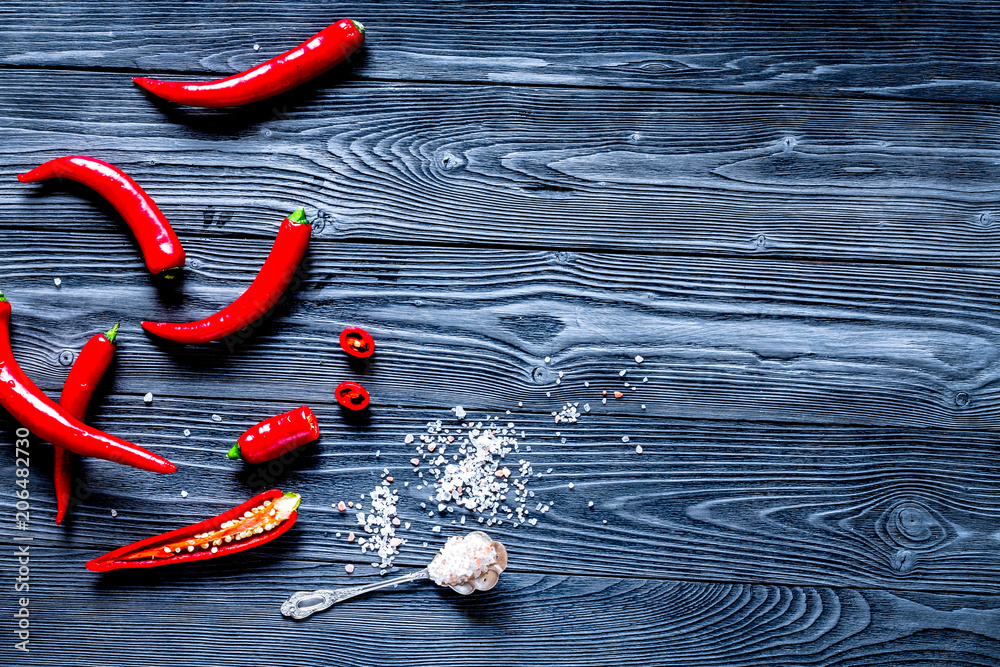 red food with chili pepper on dark background top view space for