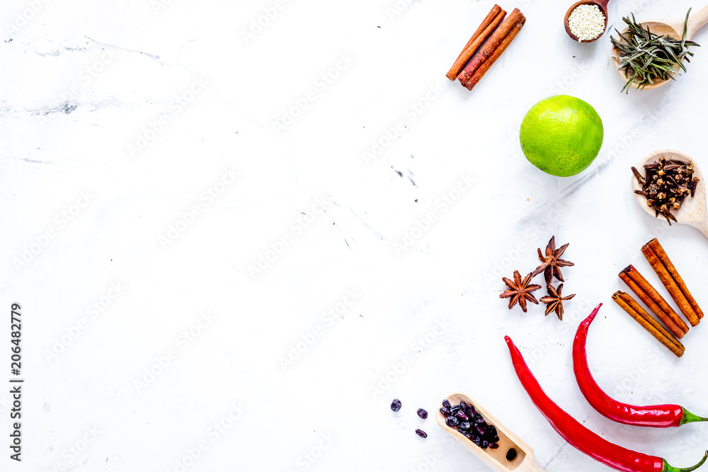 Cooking with spices, salt and pepper on kitchen table background