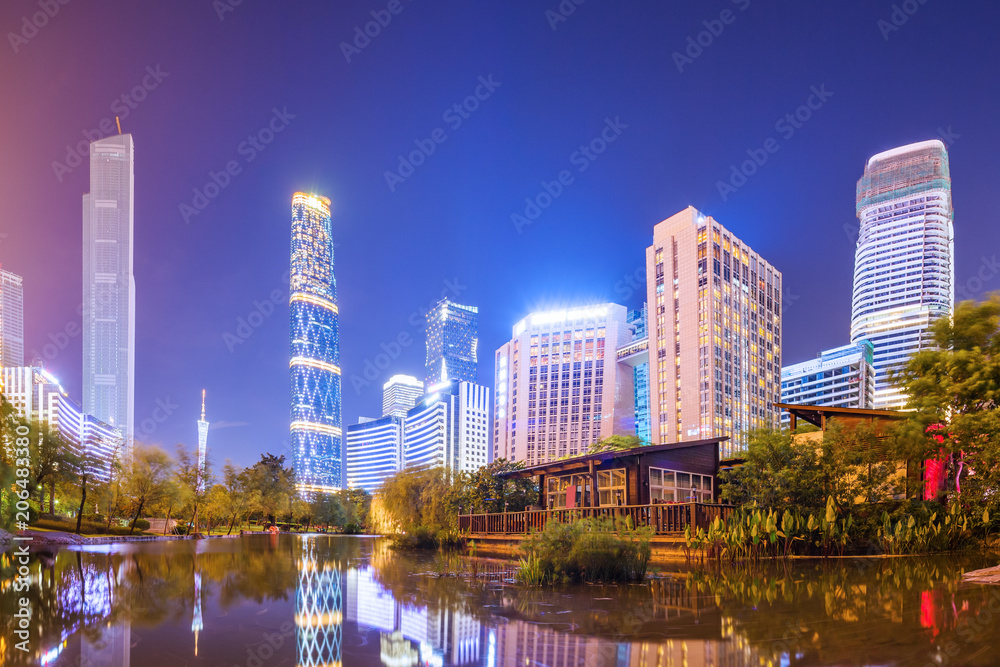 street and skyscrapers of a modern city at night