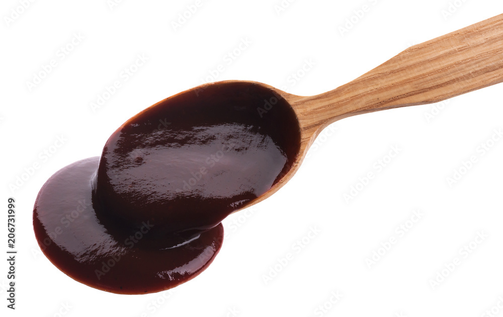 Barbecue sauce with wooden spoon isolated on white background. Top view