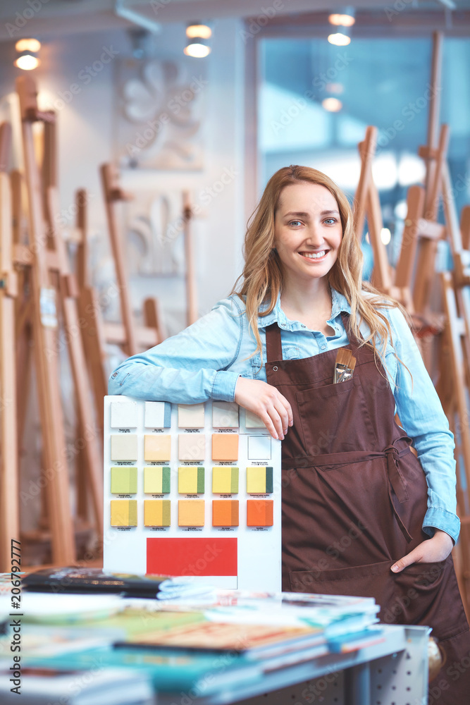 Young girl in an apron in the store