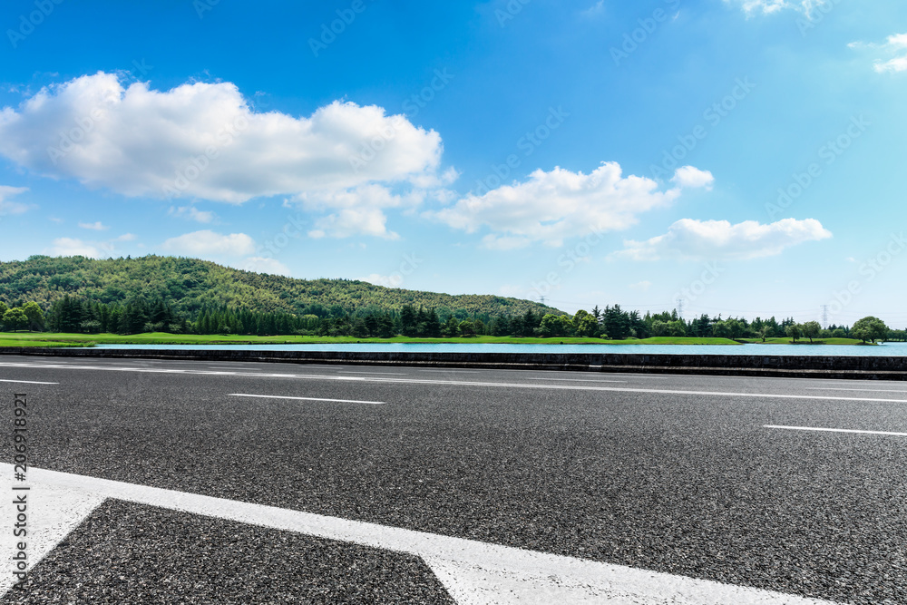 Empty asphalt road and mountains with sky clouds landscape