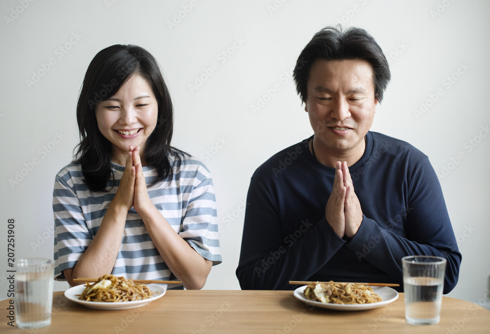 Asian couple about to eat noodles