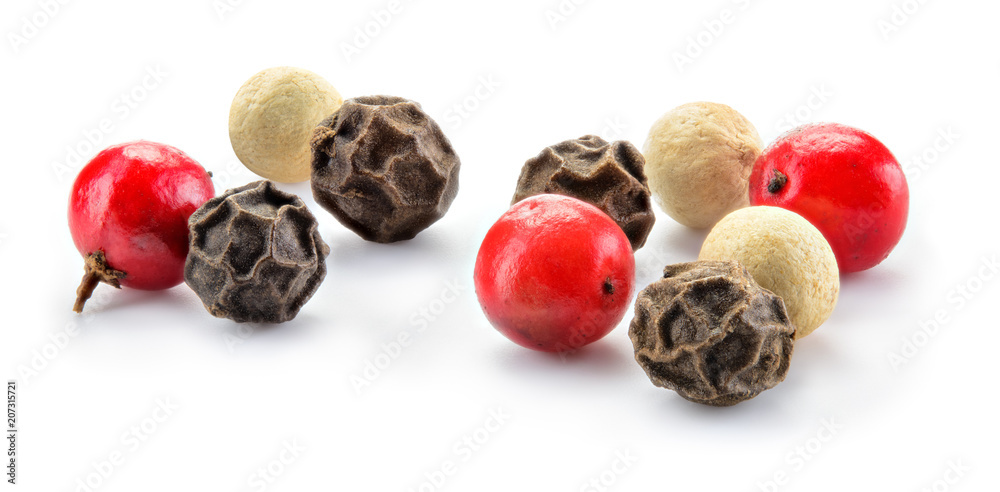 Mix of different peppers. Black, red and white peppercorns isolated on white background. Spice macro