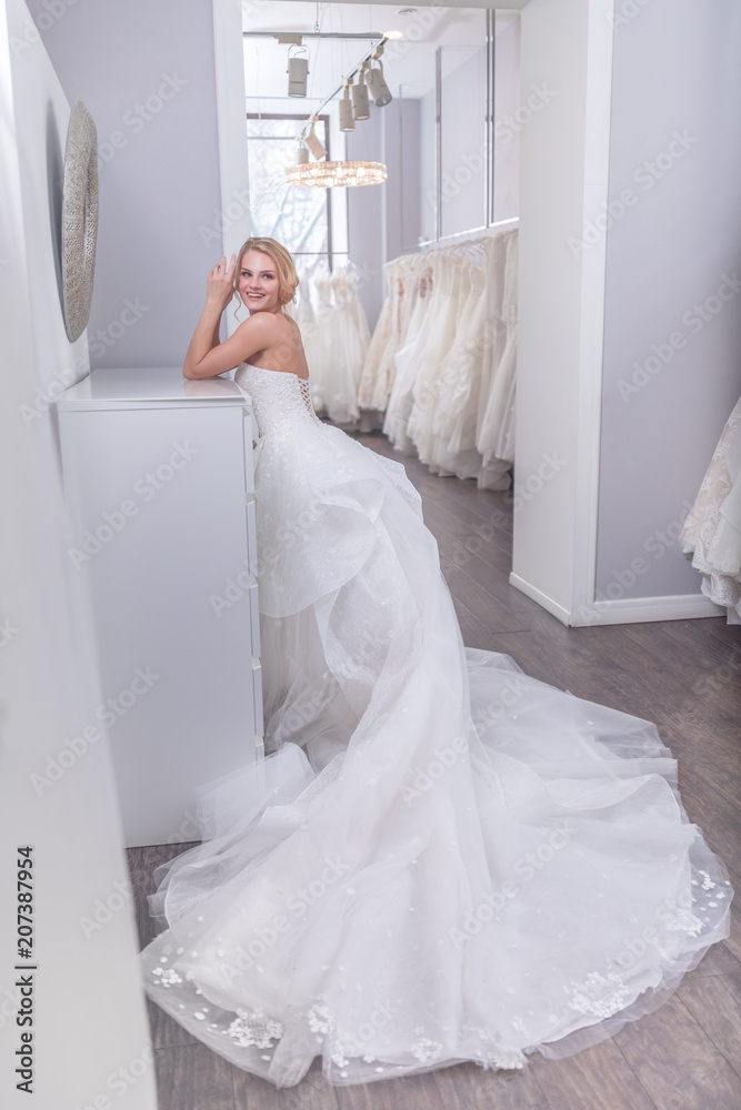 Beautiful woman in a white dress indoors