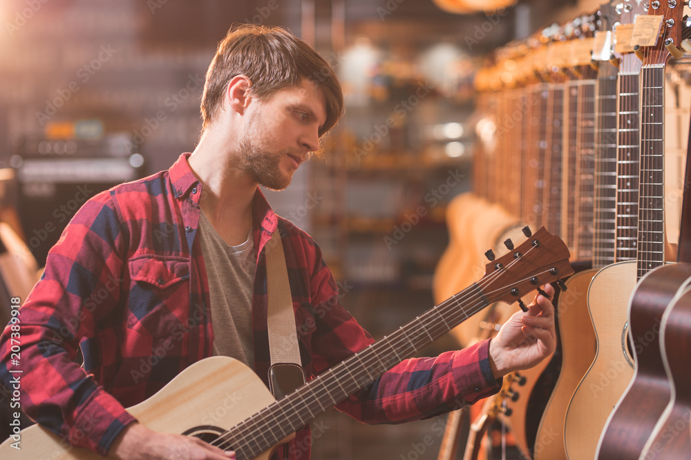 Young customer with a guitar