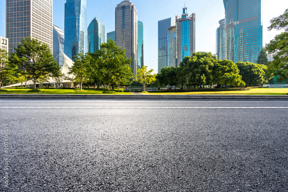 city skyline with asphalt road