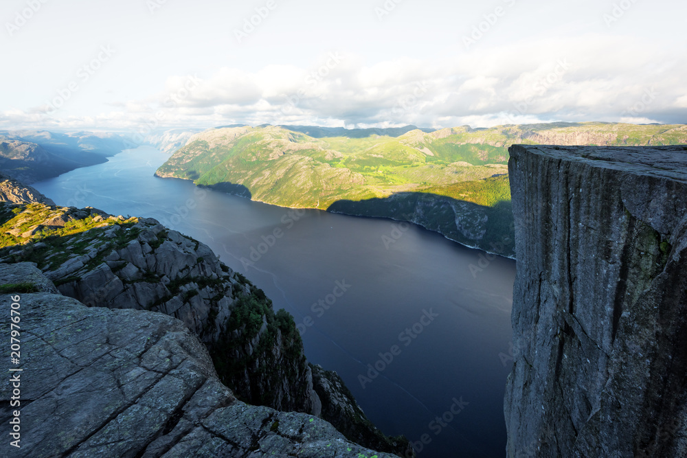 Colourful sunrise on Preikestolen (pulpit-rock) - famous tourist attraction in the municipality of F