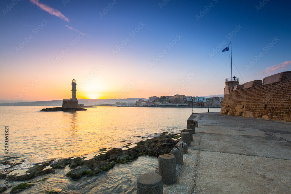 Lighthouse of the old Venetian port in Chania at sunrise, Crete. Greece