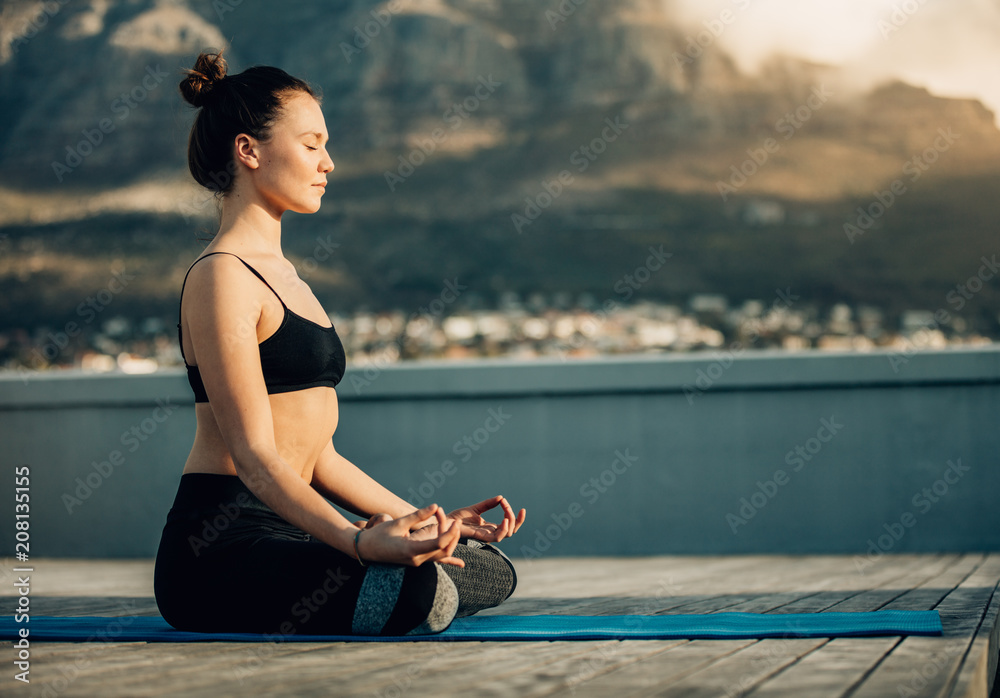 Woman doing yoga outdoors