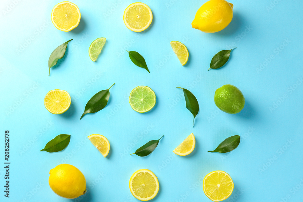 Composition with cut citrus fruits on color background, top view