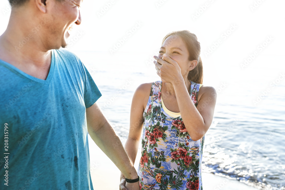 Couple walking together at the beach