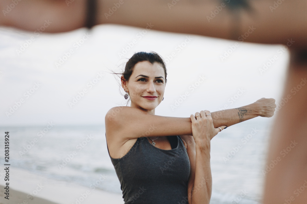 Couple exercising on a beach