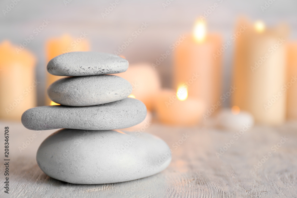 Stack of spa stones on wooden table