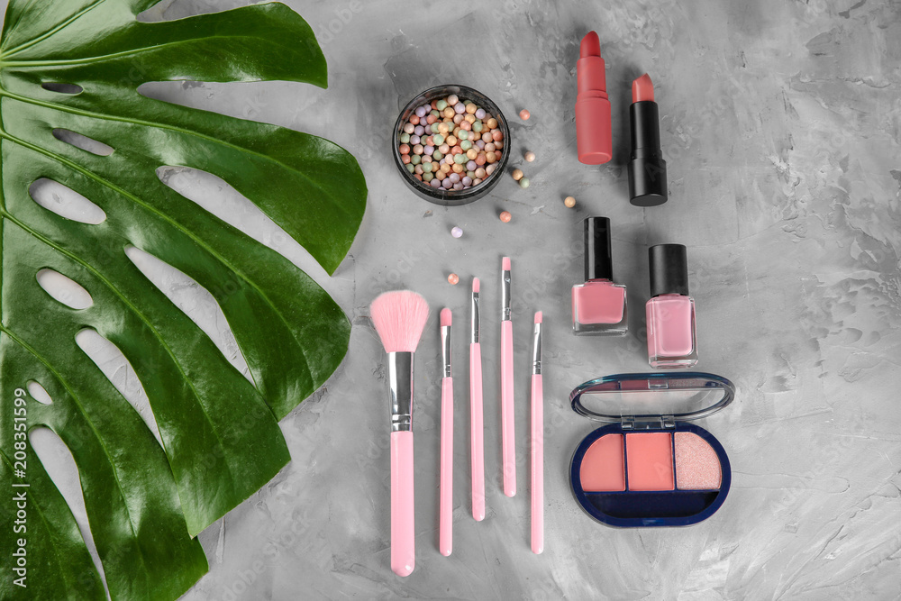 Flat lay composition with professional cosmetics on grey background