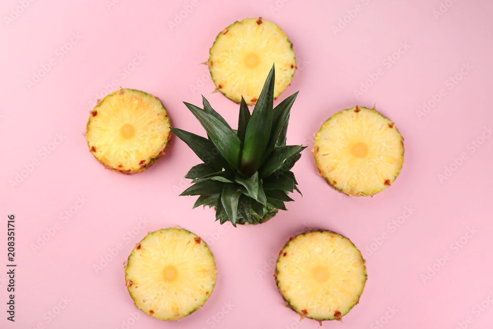 Composition with fresh pineapple slices on color background