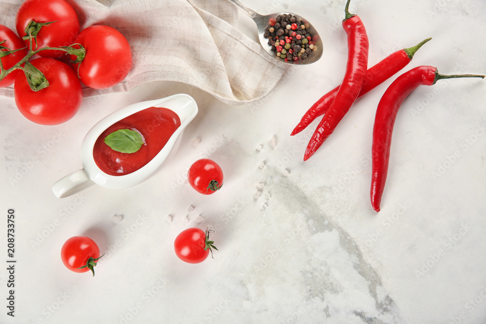 Flat lay composition with red sauce and vegetables on light background