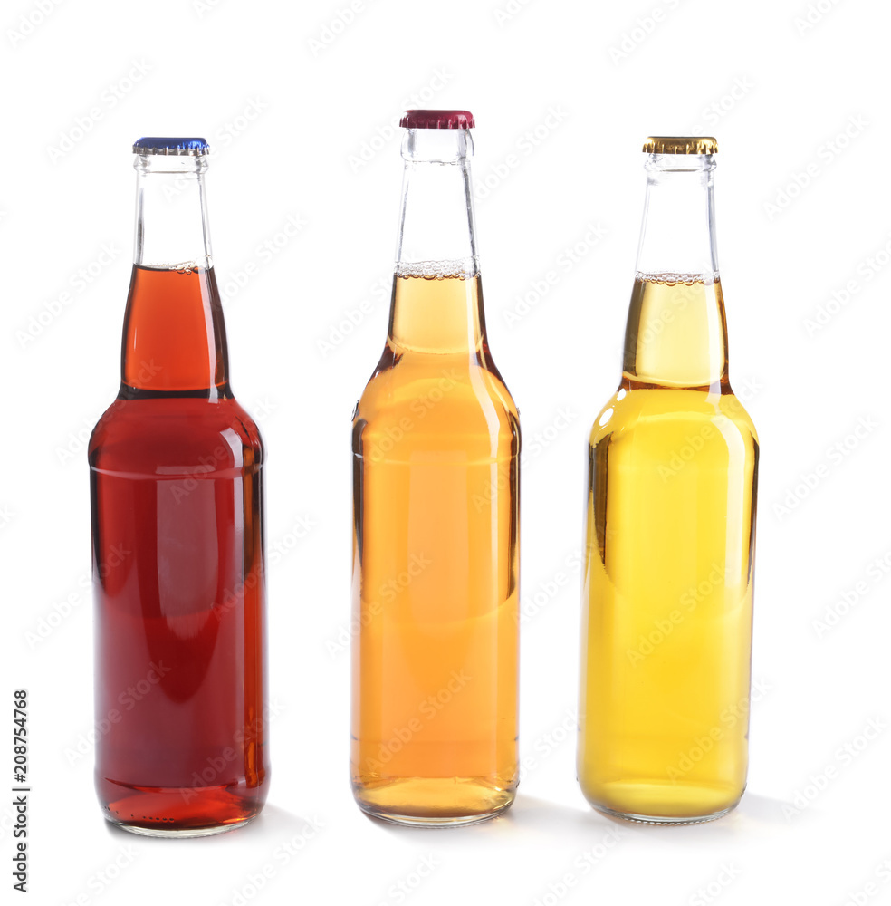 Glass bottles of beer on white background