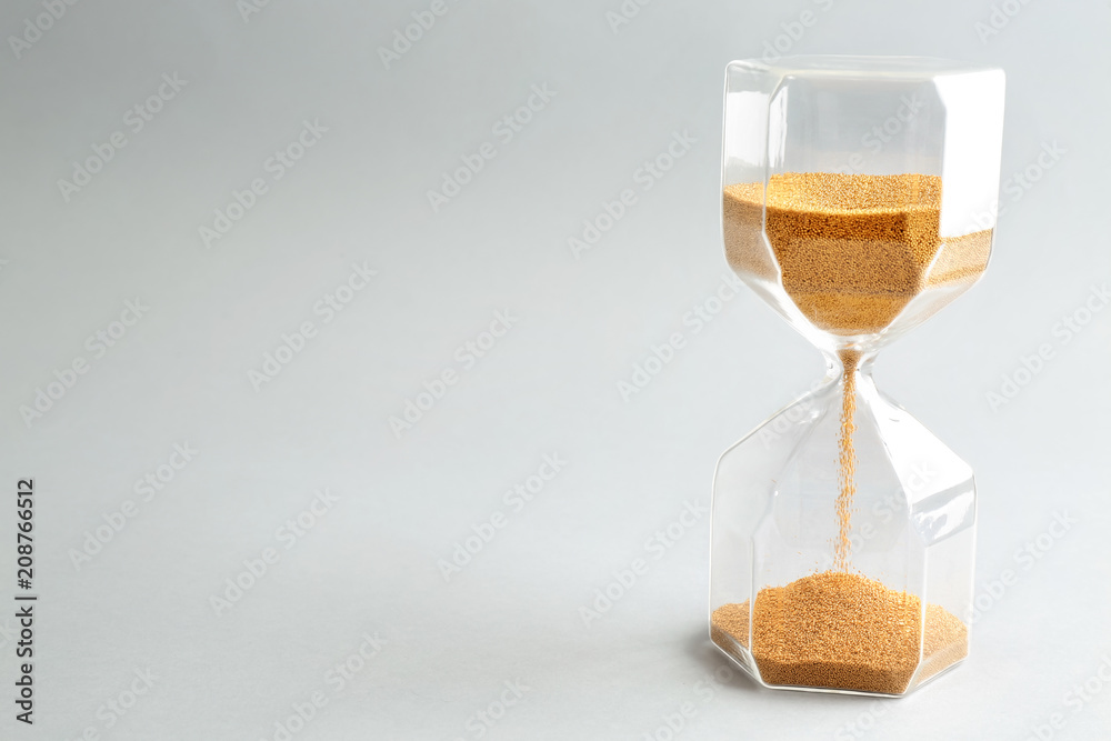 Hourglass on light background. Time management concept