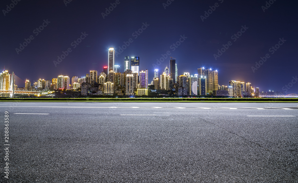 Panoramic skyline and buildings with empty road，chongqing city at night