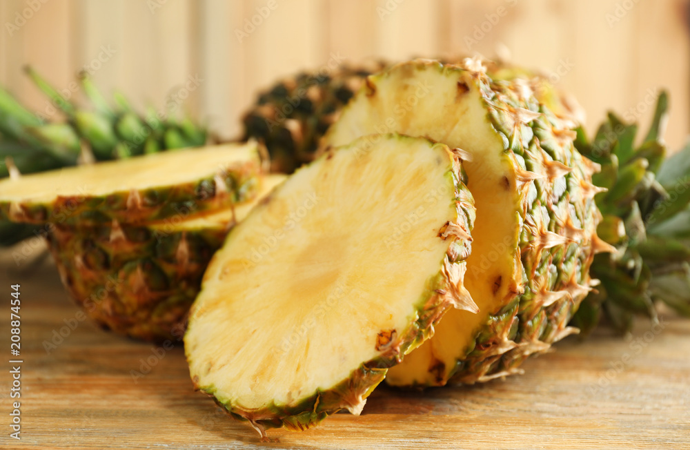 Sliced fresh pineapple on table, closeup