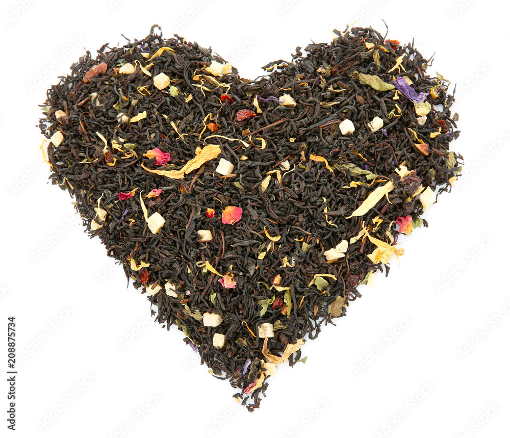 Heart made with dry tea leaves on white background, top view