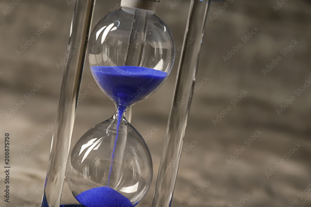 Hourglass on gray background. Time management concept