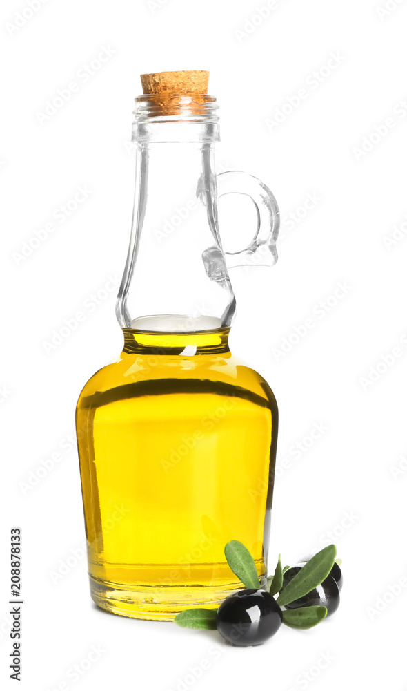 Fresh olive oil in jug and black olives on white background