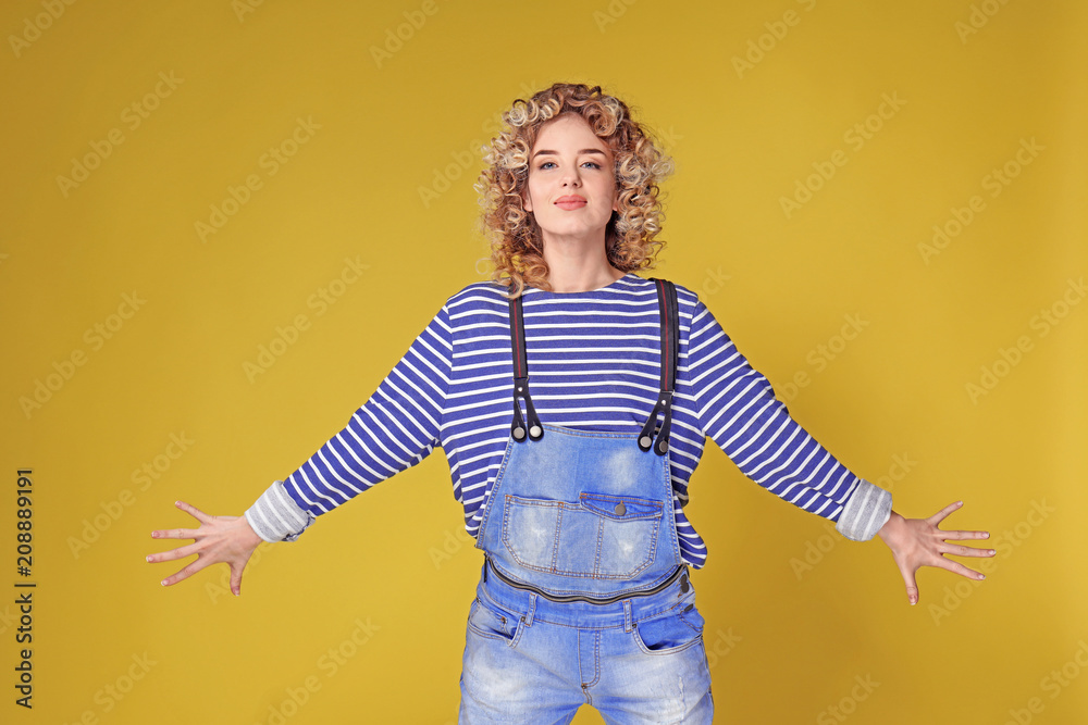 Portrait of beautiful young woman on color background