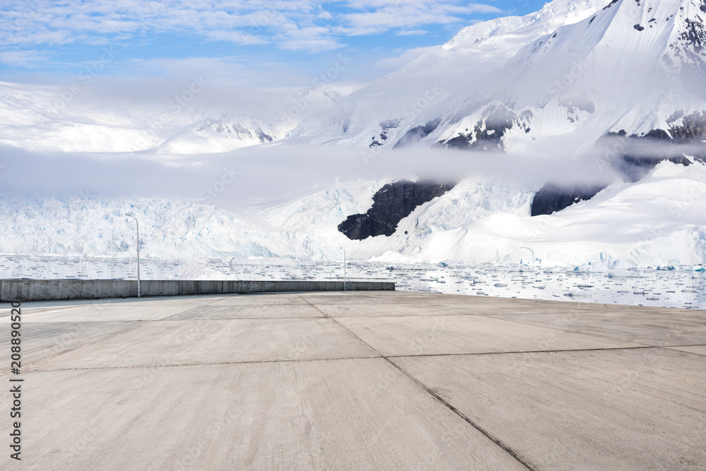 empty brick ground with sonw mountain as background