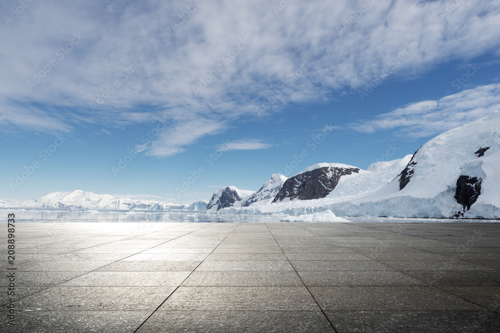 empty brick ground with sonw mountain as background